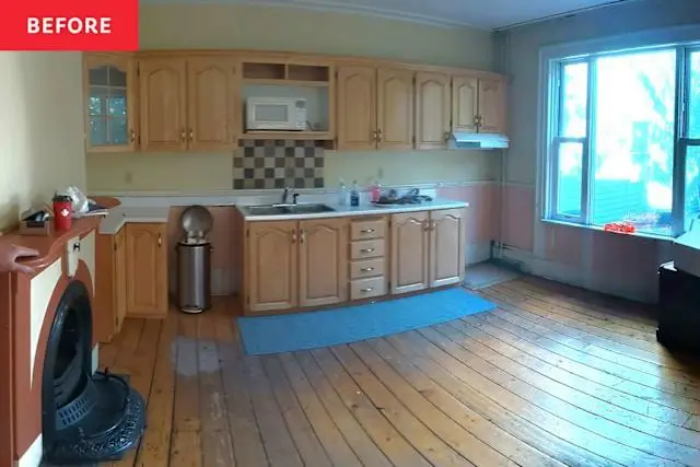 Before — dark flooring and dated finishes.